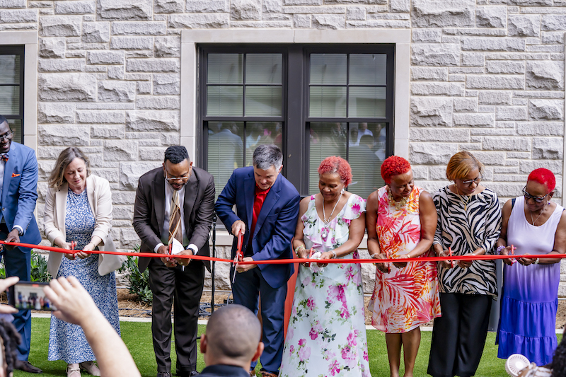 Belmont leadership and Mishaw family cutting ribbon