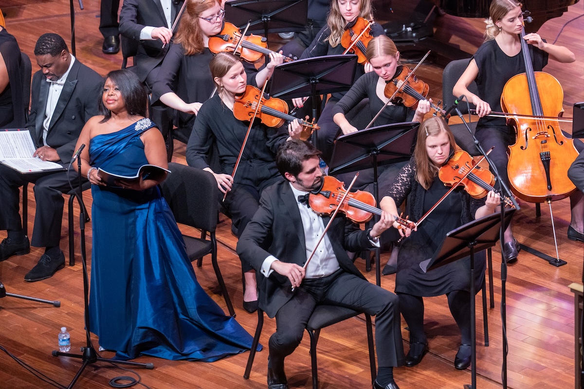 a group of musicians perform on stage