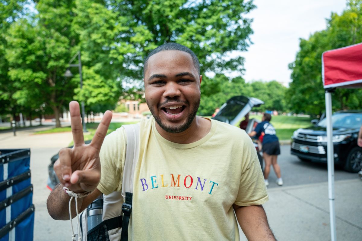 Student doing peace sign