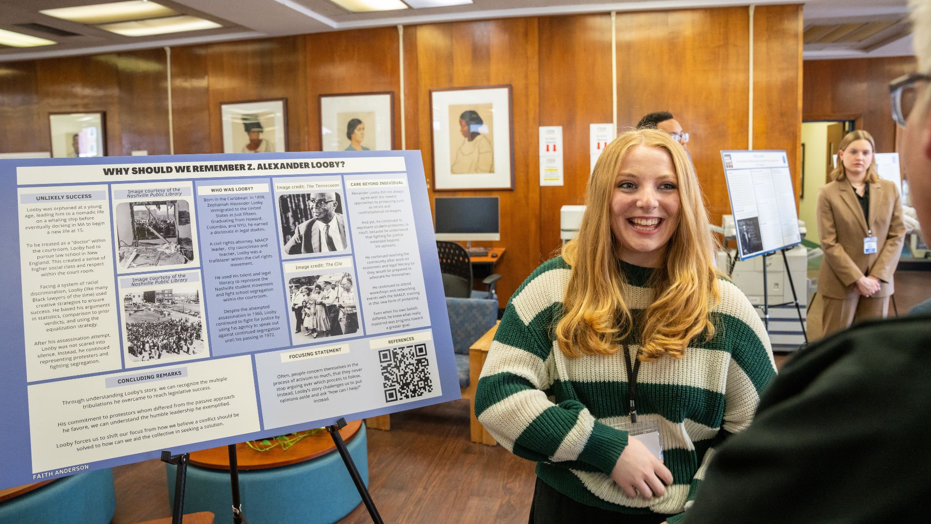 Student presents her poster