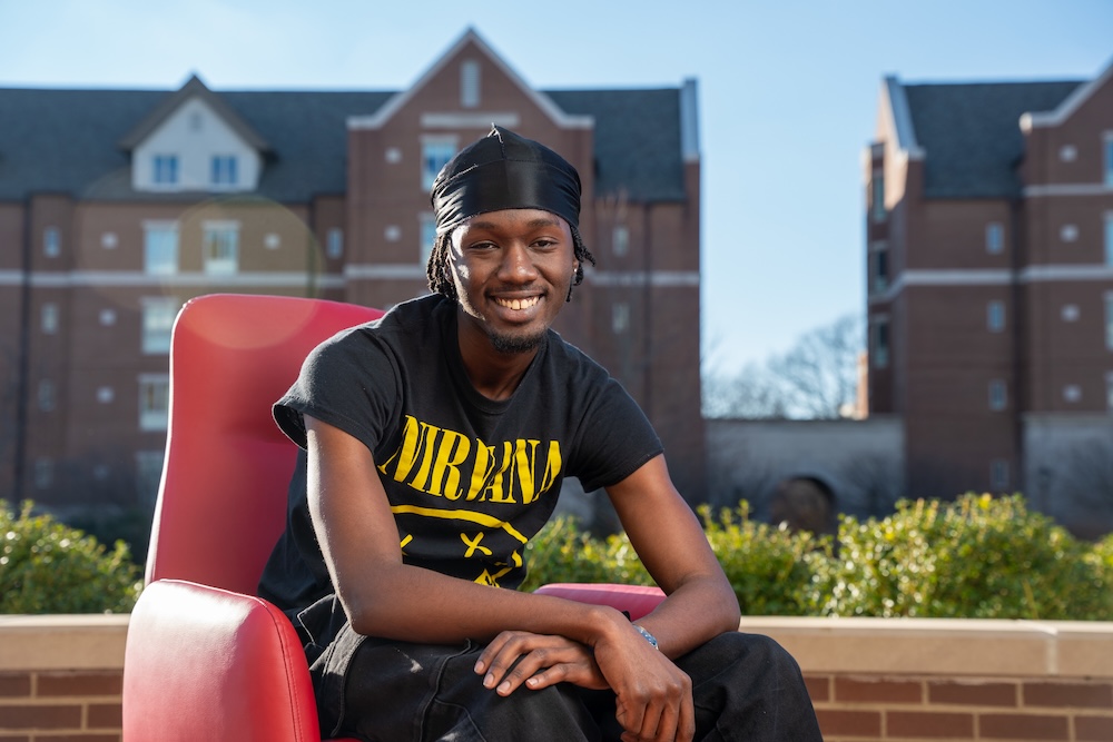 student smiles in a pop up portrait