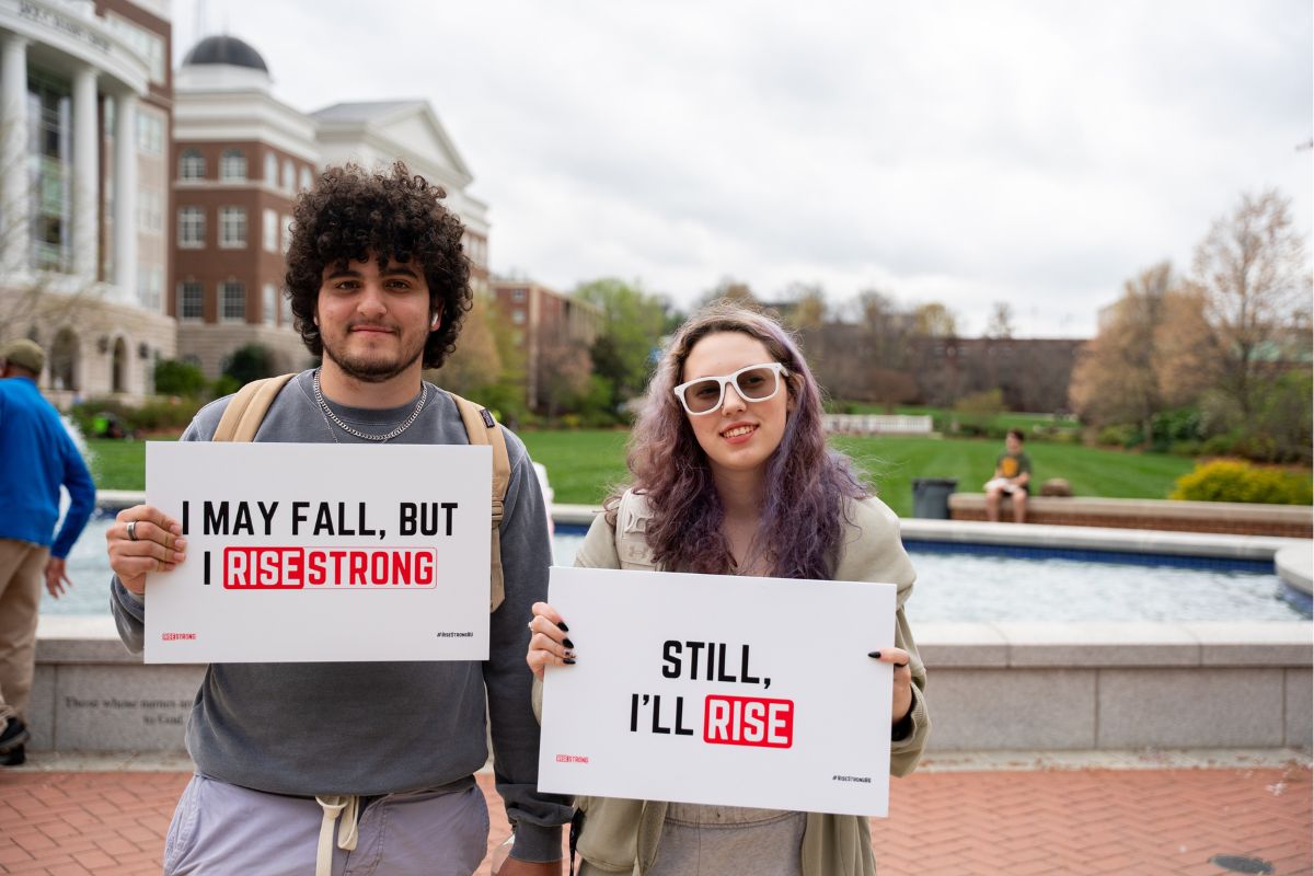 Students holding RiseStrong students