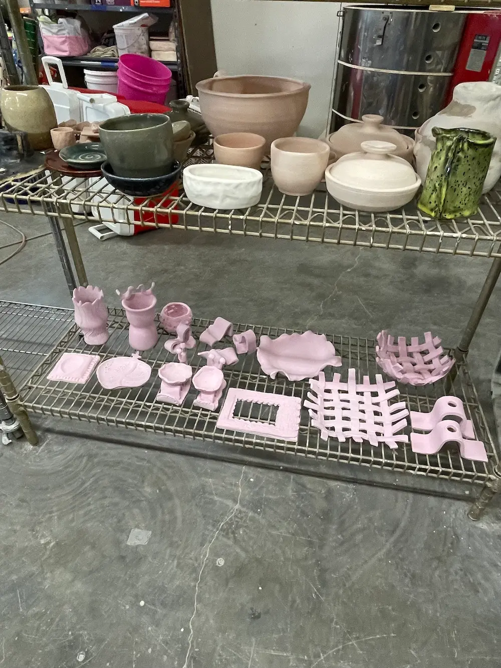 In progress pottery from the workshop, pink before the process has finished