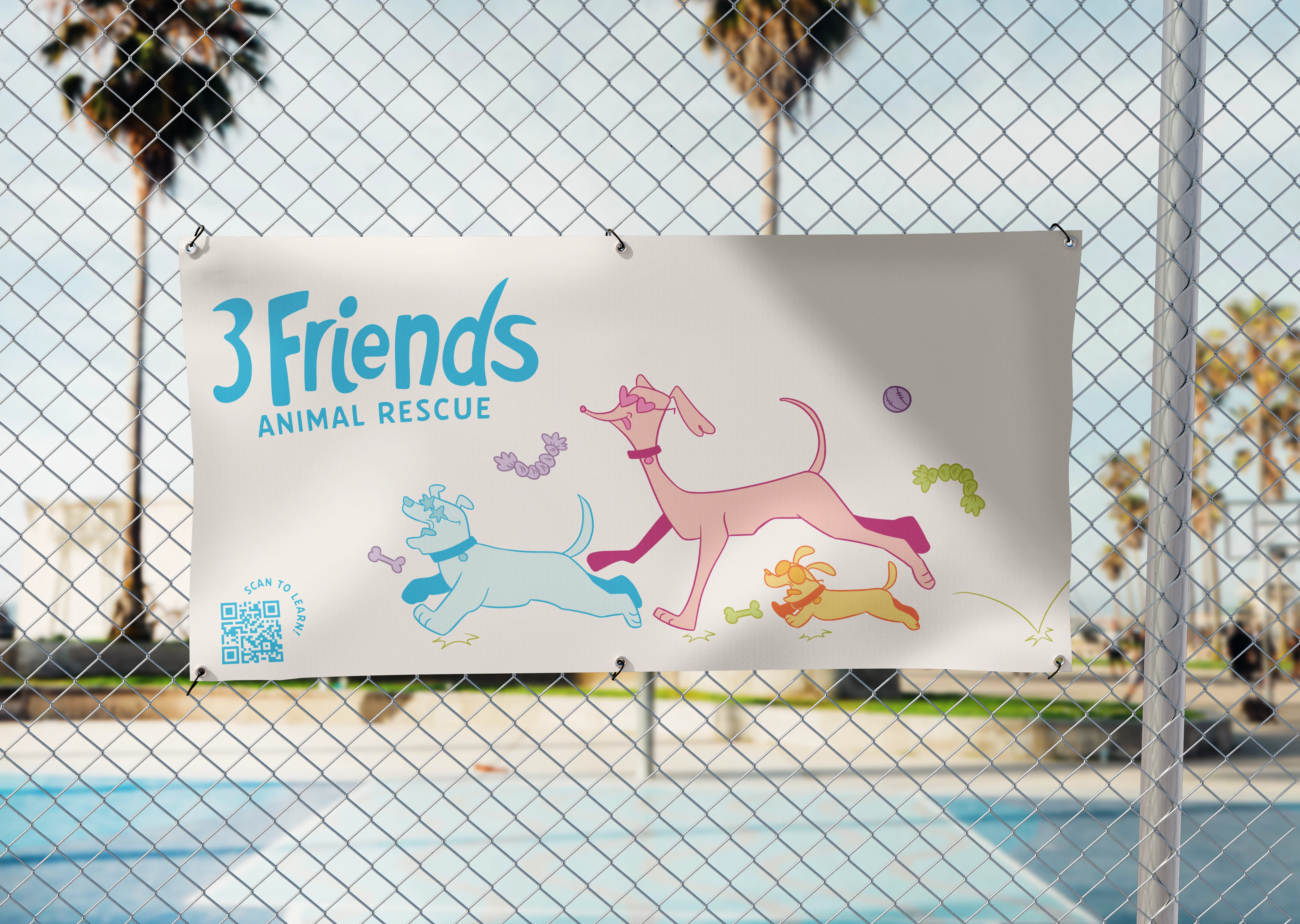 Large banner with student design hanging on a fence