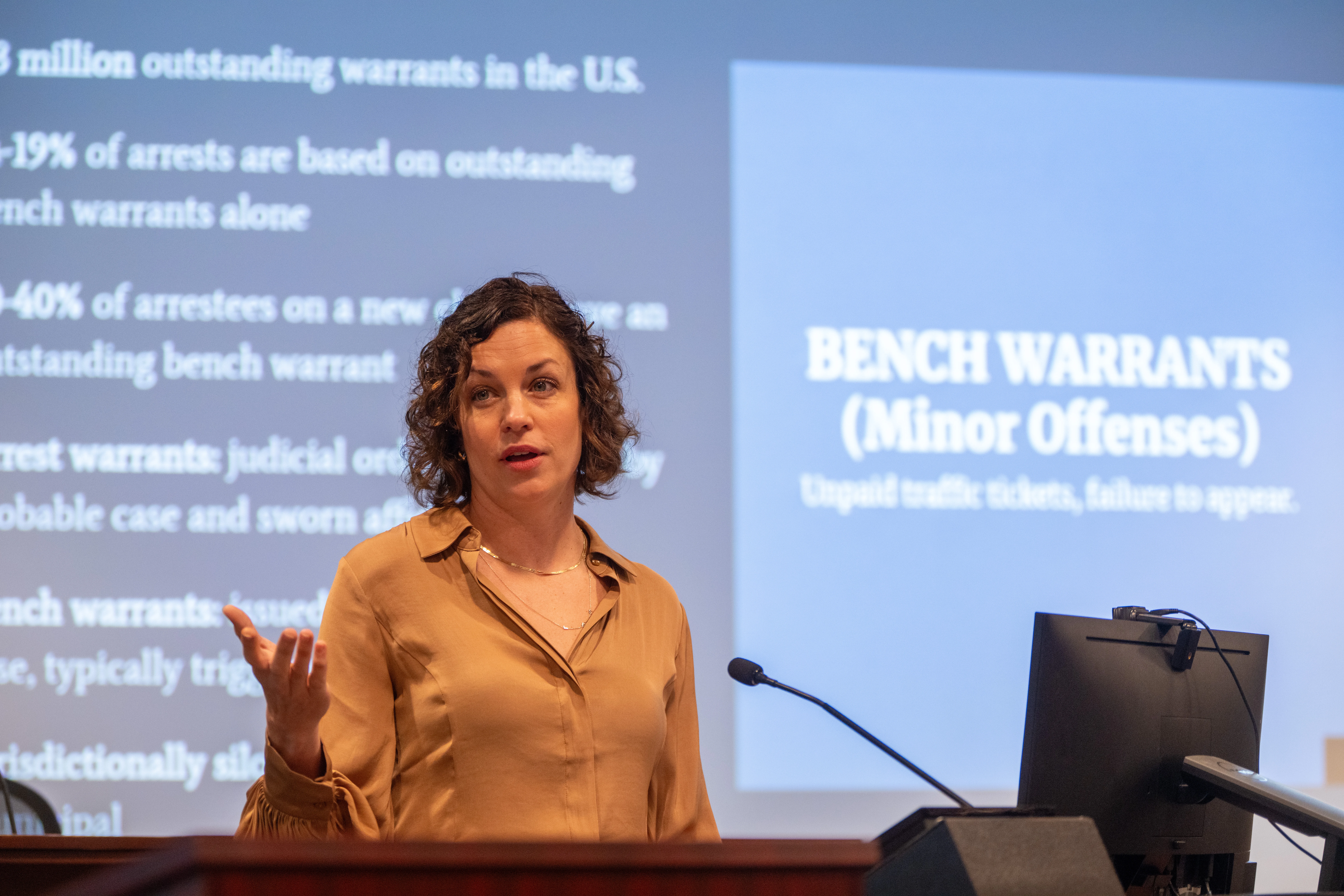 woman speaking at the symposium
