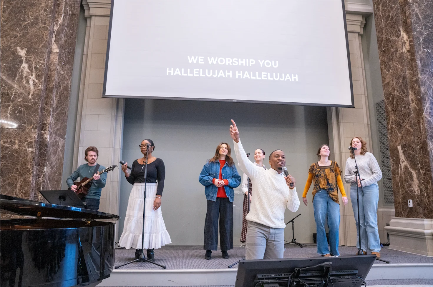A group of musicians performing worship songs