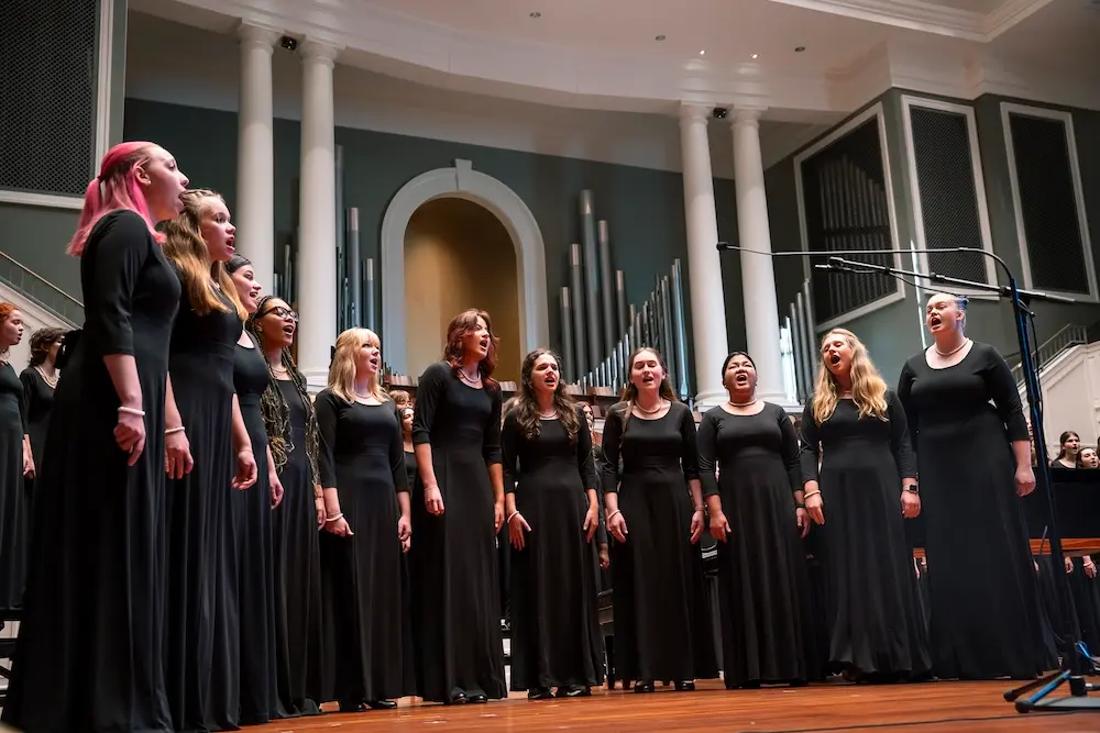 singers performing on stage