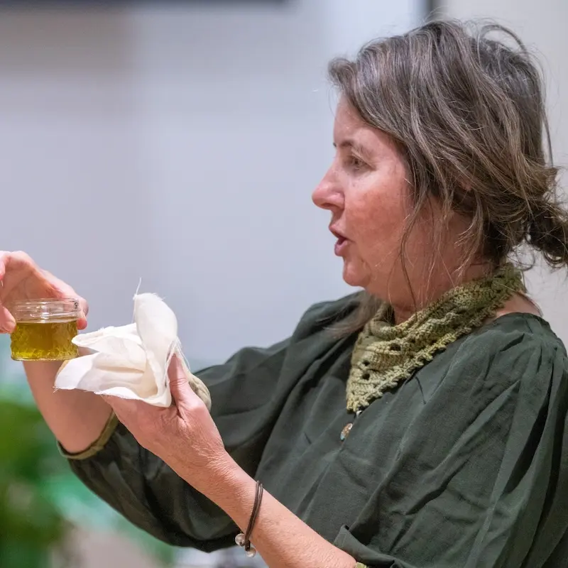 dana stein demonstrating how to make lavender essential oil 