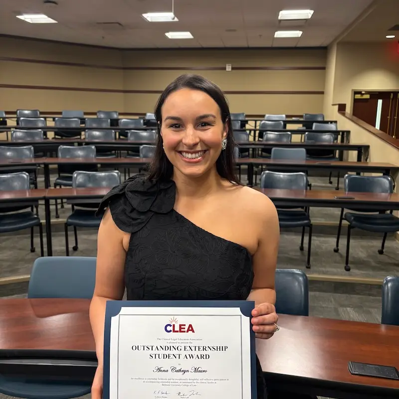 Anna Cathryn Mauro holding certificate