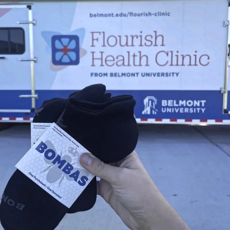 Bombas socks in front of the Flourish mobile clinic