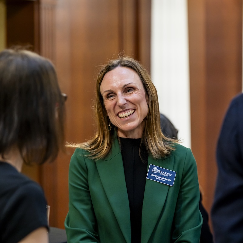 Deborah Farringer speaking with colleagues