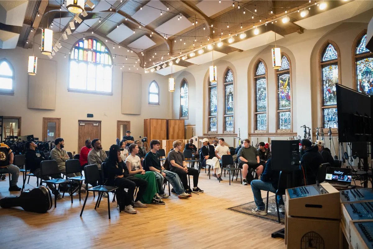 Belmont students seated listening to rapper Stalley speak