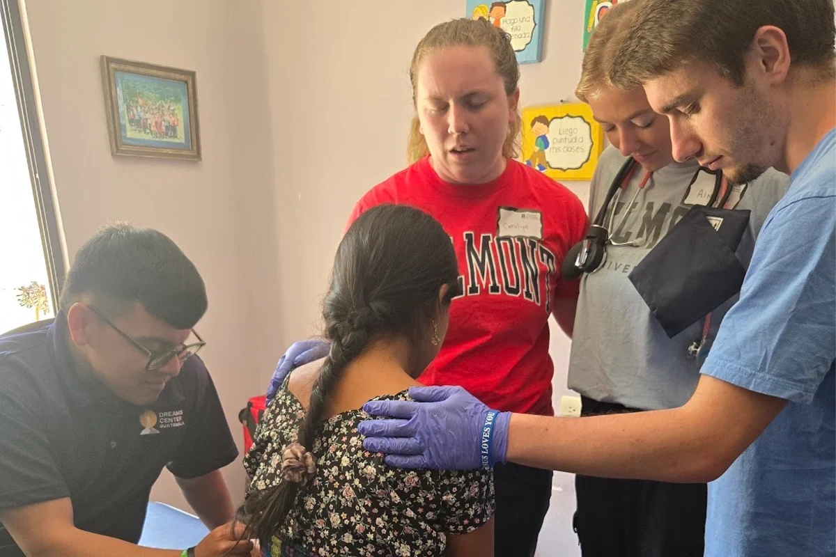 Students doing mission work with community members 