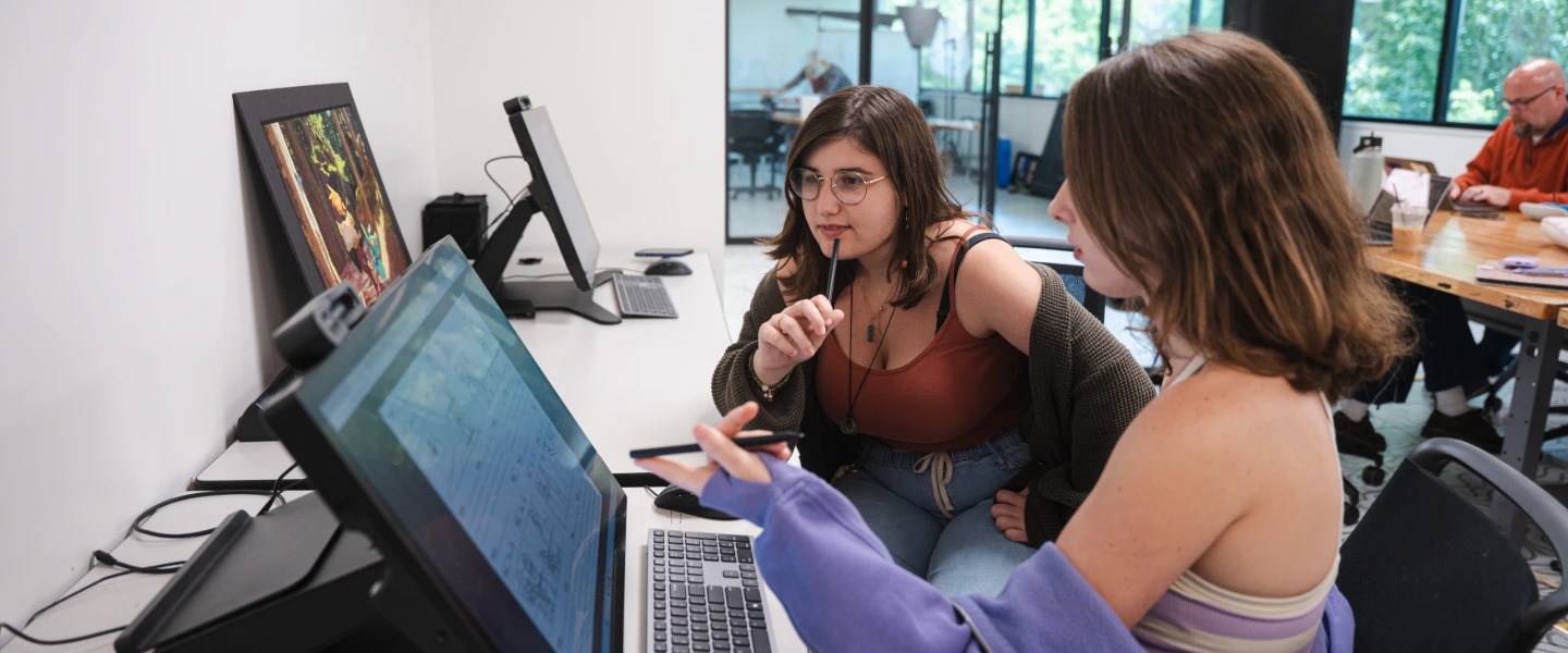 Two students collaborating on an animation project
