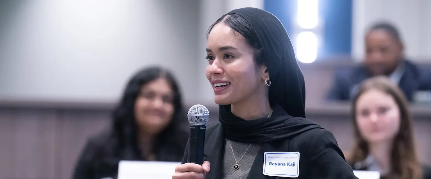 Reyana Kaji holding mic