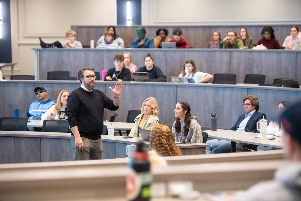 Professor teaching a room full of students