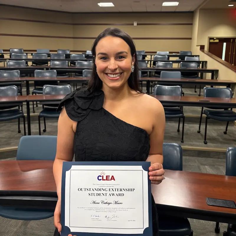 Anna Cathryn Mauro holding certificate