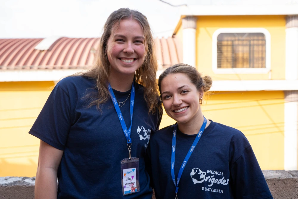 Belmont volunteers in Guatemala, smiling at the camera