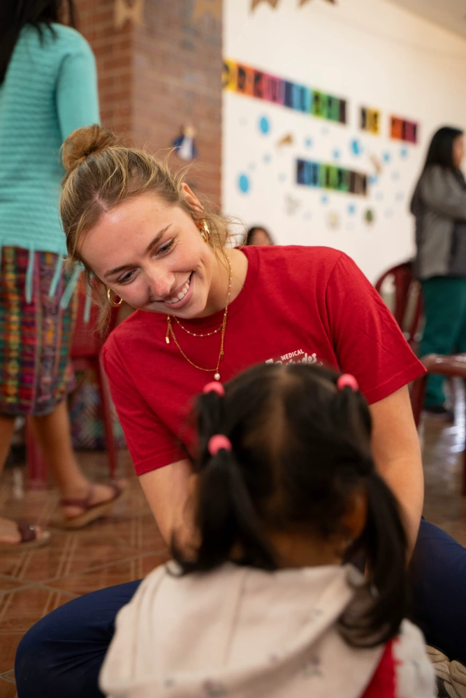 Students interacting with families in the clinic