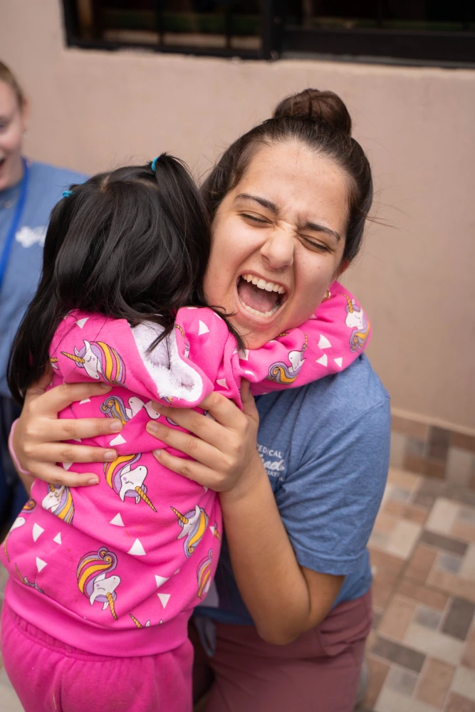 Volunteers providing comfort and building connections with local families