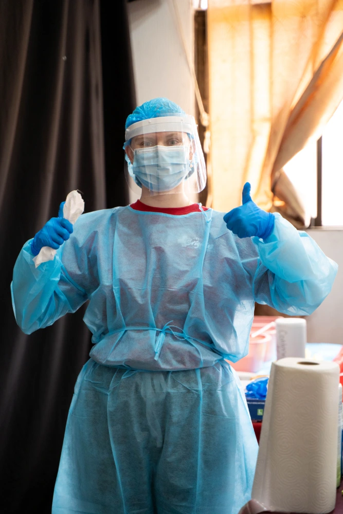 Students in PPE working in the clinic