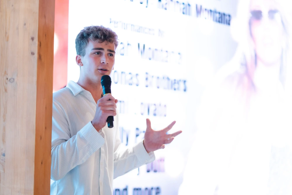 A man speaks into a microphone