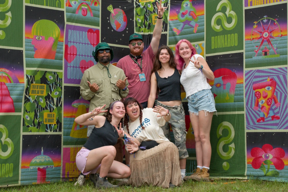 A group of smiling students outside