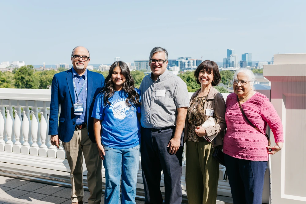 Clinical faculty pose for a group photo on a rooftop terrace at the Thomas F. Frist, Jr. College of Medicine.