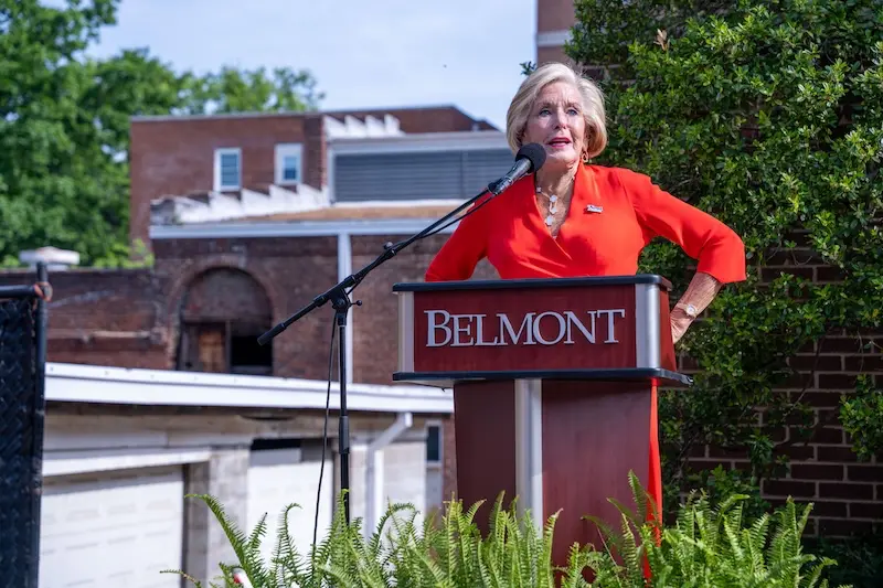 Cordia Harrington speaking at podium