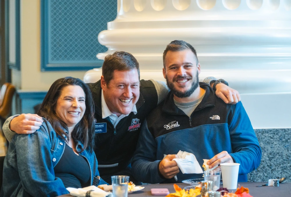 Faculty and staff pose together at brunch
