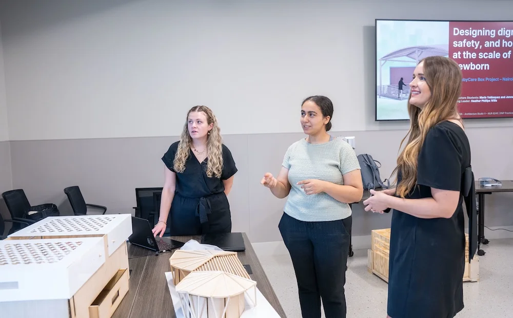 Dr. Dambrino consults architecture students on their designs