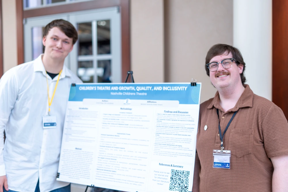 Boggs presents findings with colleague at SPARK