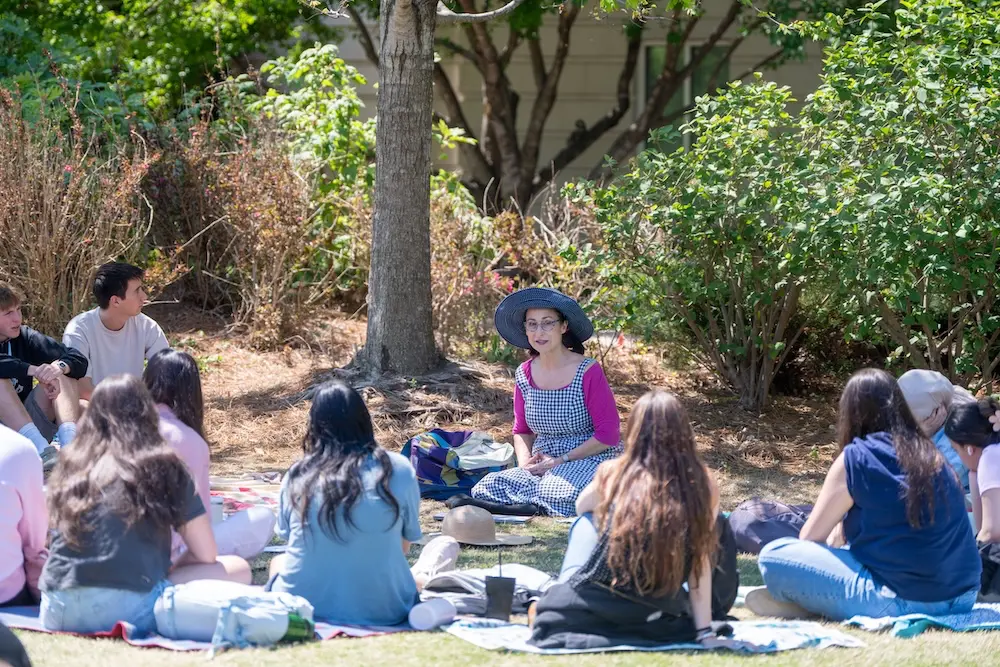 Class sitting in a circle outside