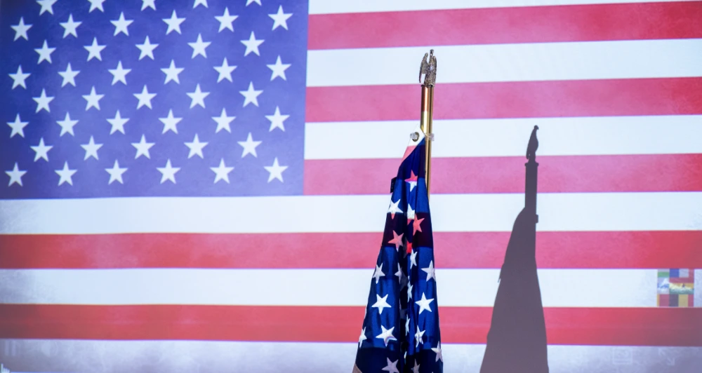 An American flag projected on a wall
