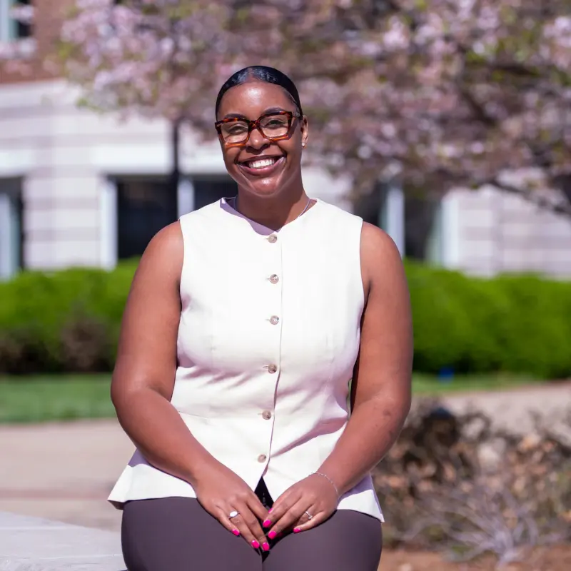 Caelyn Rolle sitting outside of belmont 