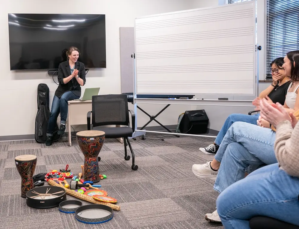 a woman leading a music therapy session