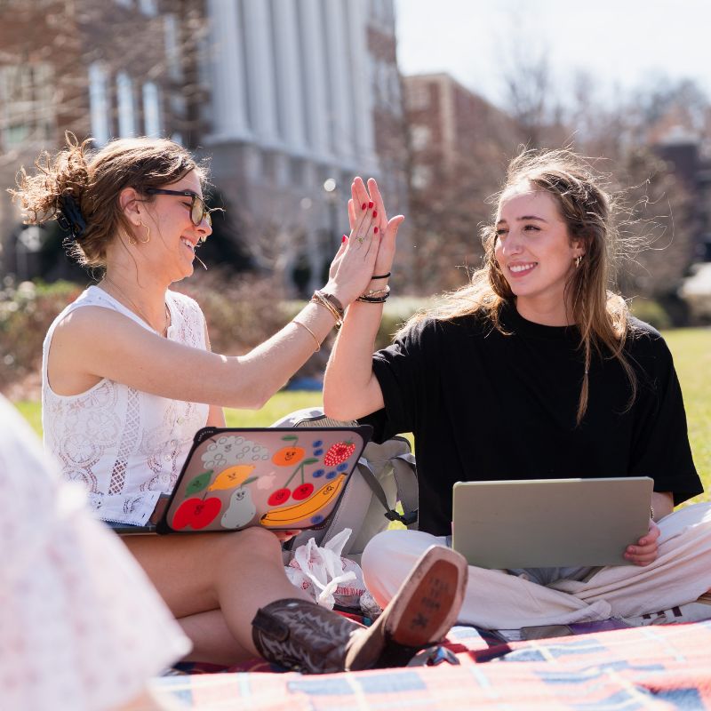 Students giving each other a high five