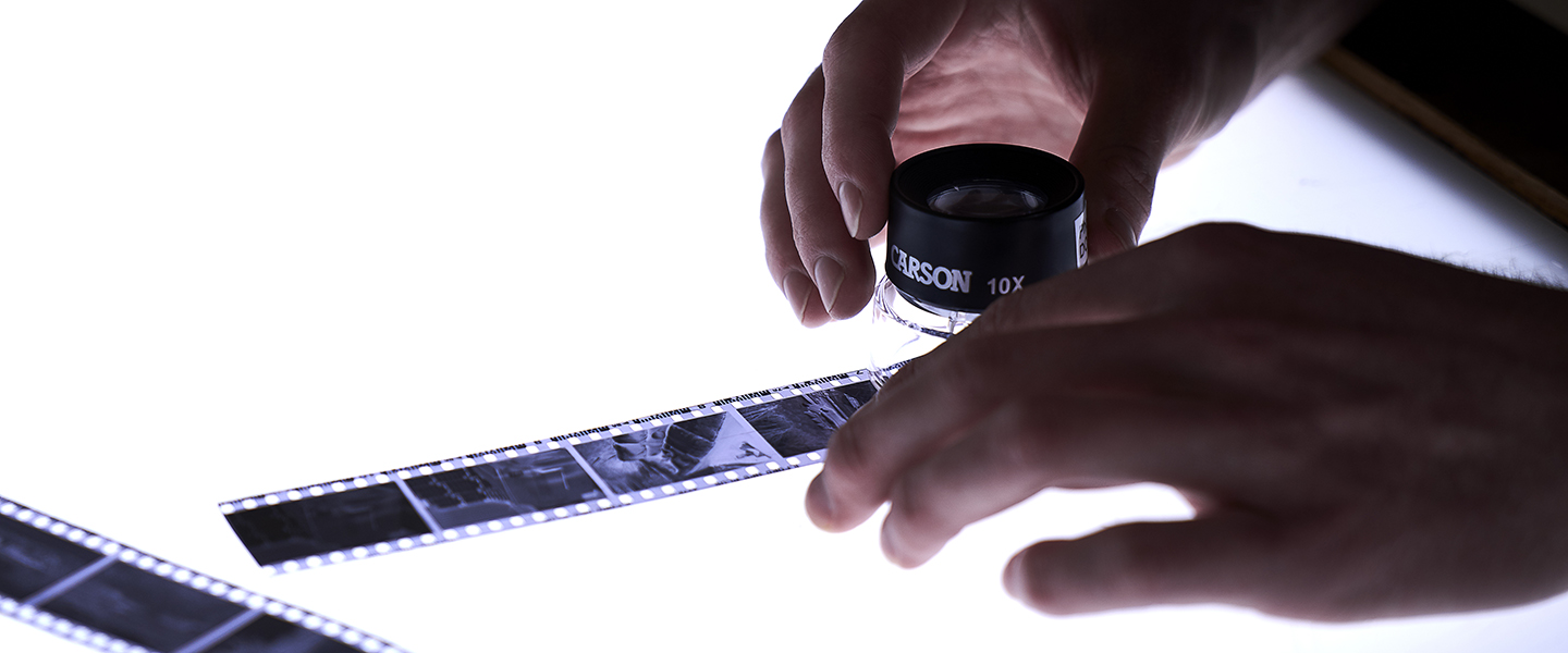 Student working on view camera film on a light table