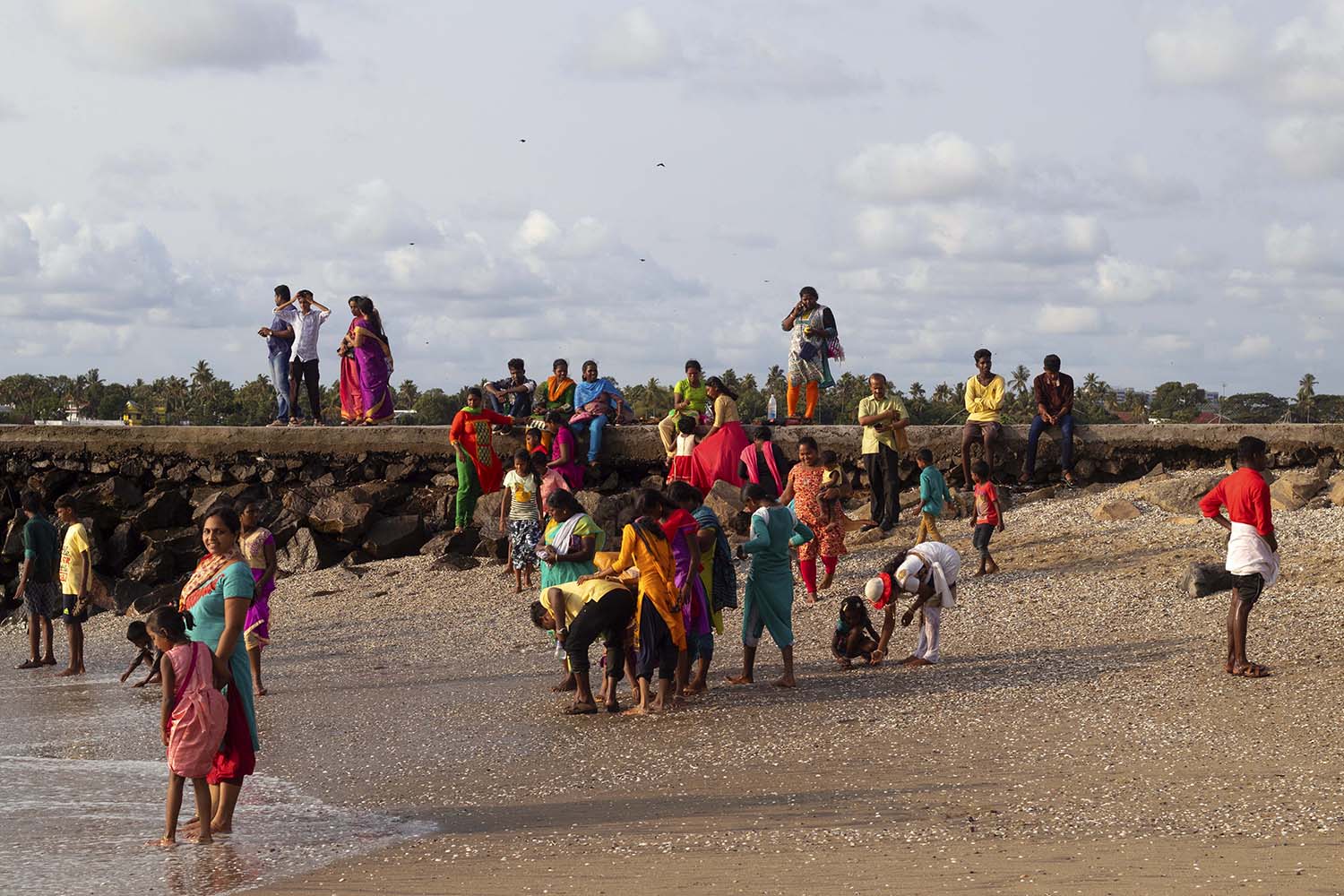 Photo of families on shore in India